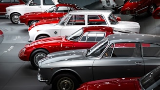 A bunch of cars are parked in a garage