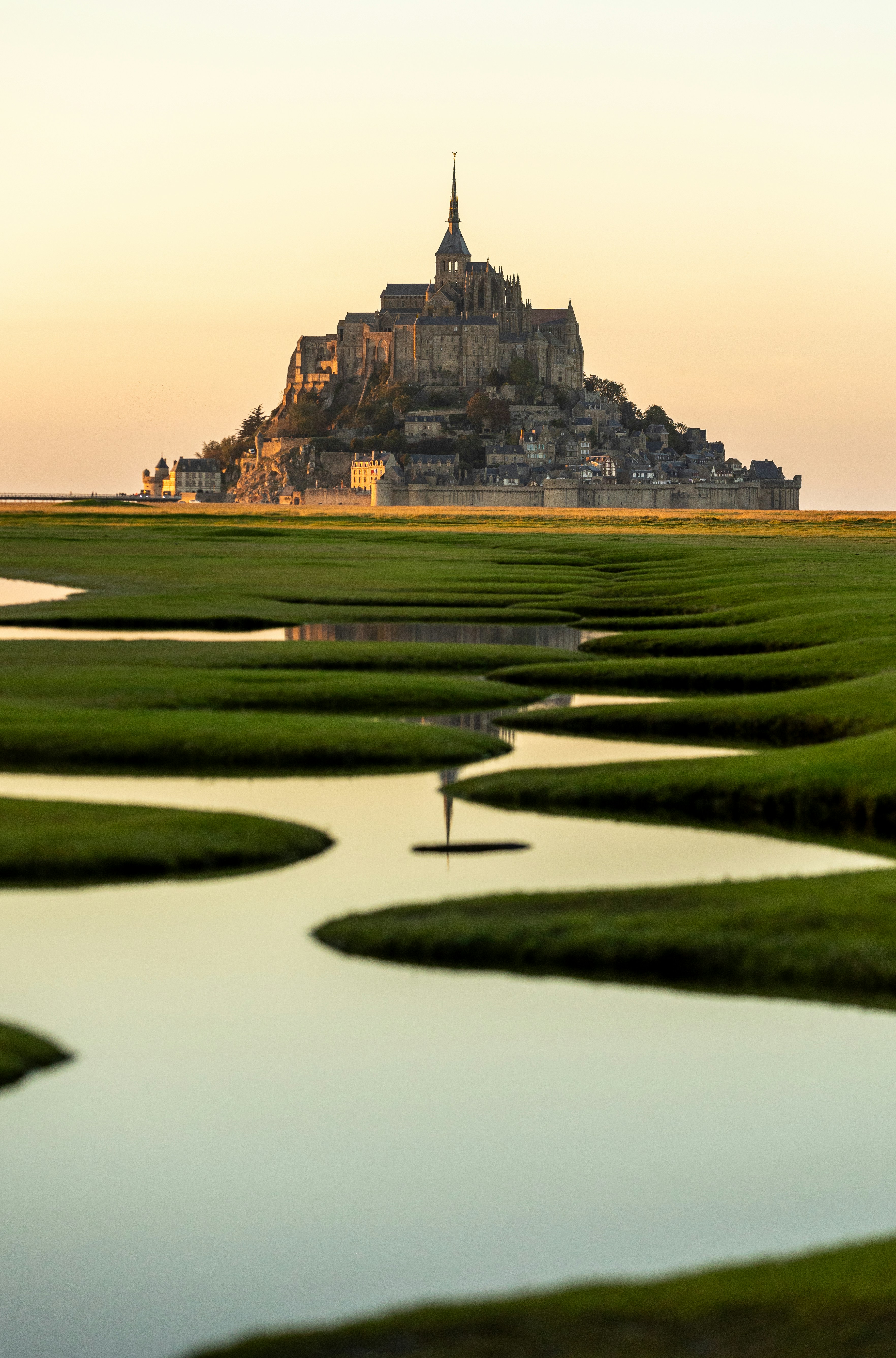 A small island in the middle of a body of water