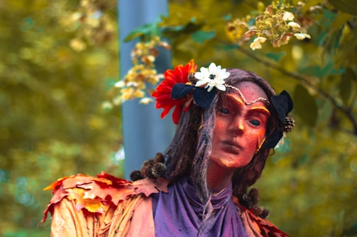 A man in a costume with flowers in his hair