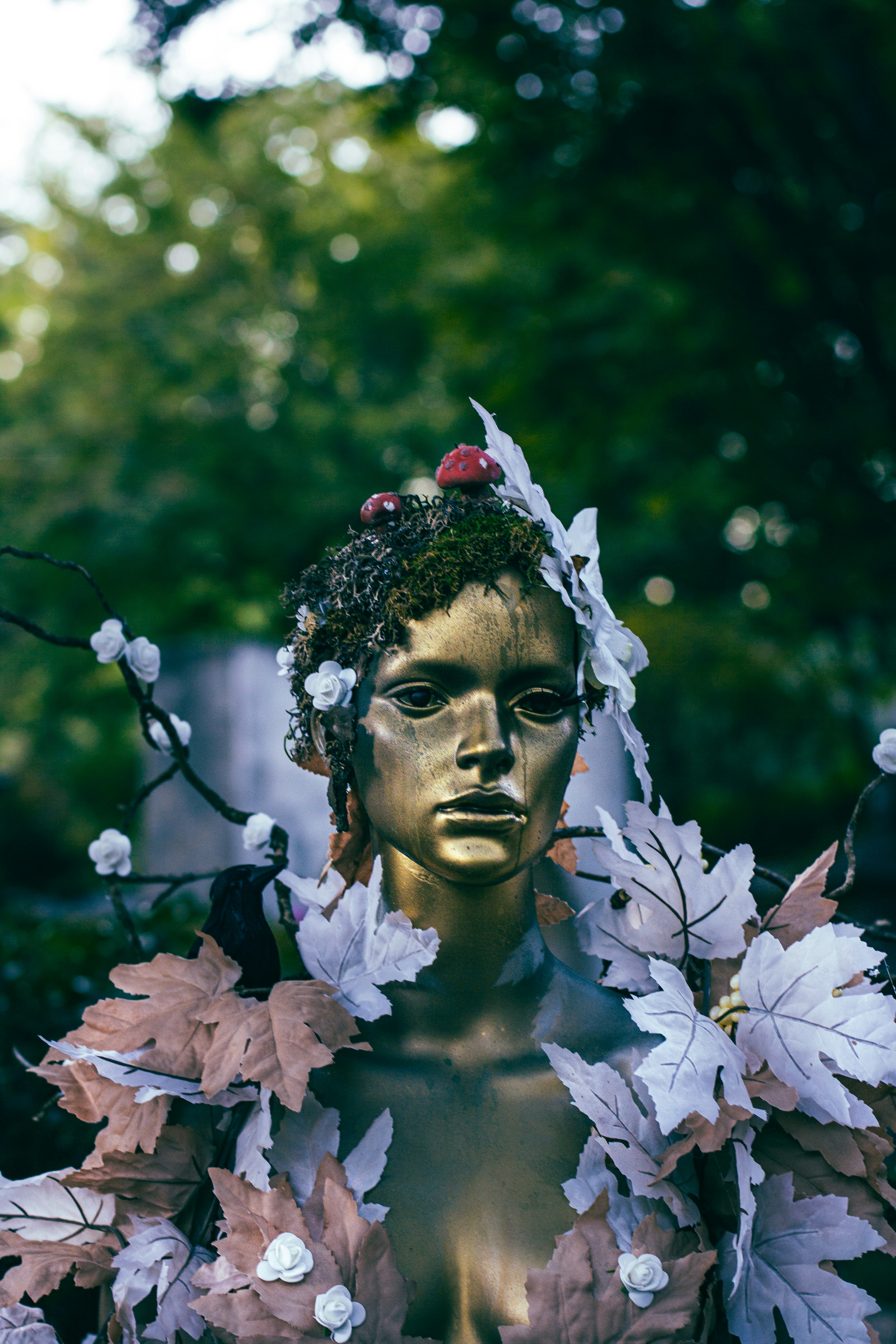 A statue of a woman with flowers in her hair