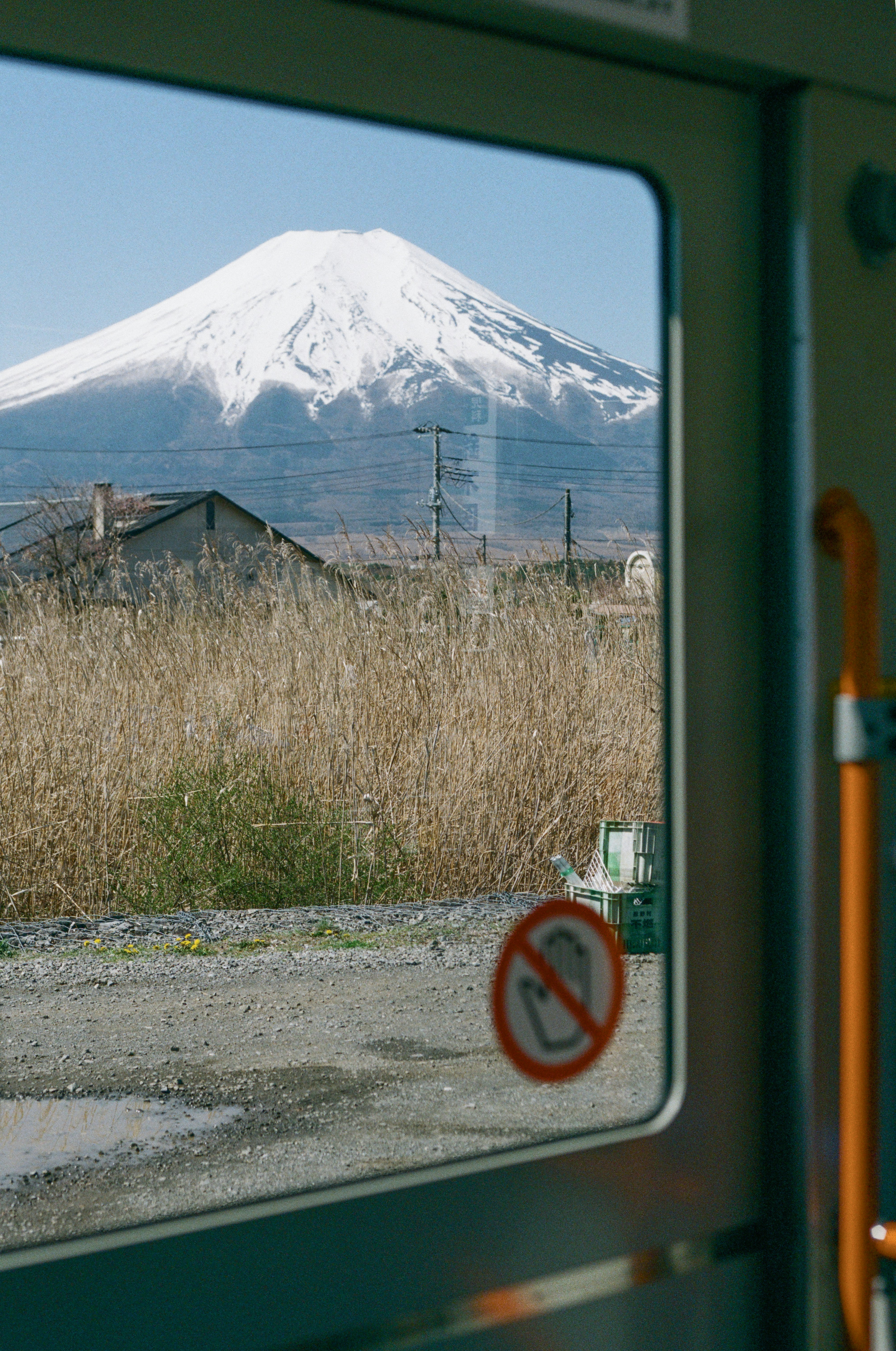 A view of a mountain through a train window