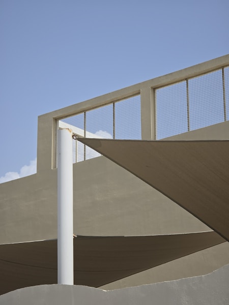 A skateboarder is doing a trick on a ramp