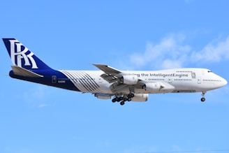 A large jetliner flying through a blue sky