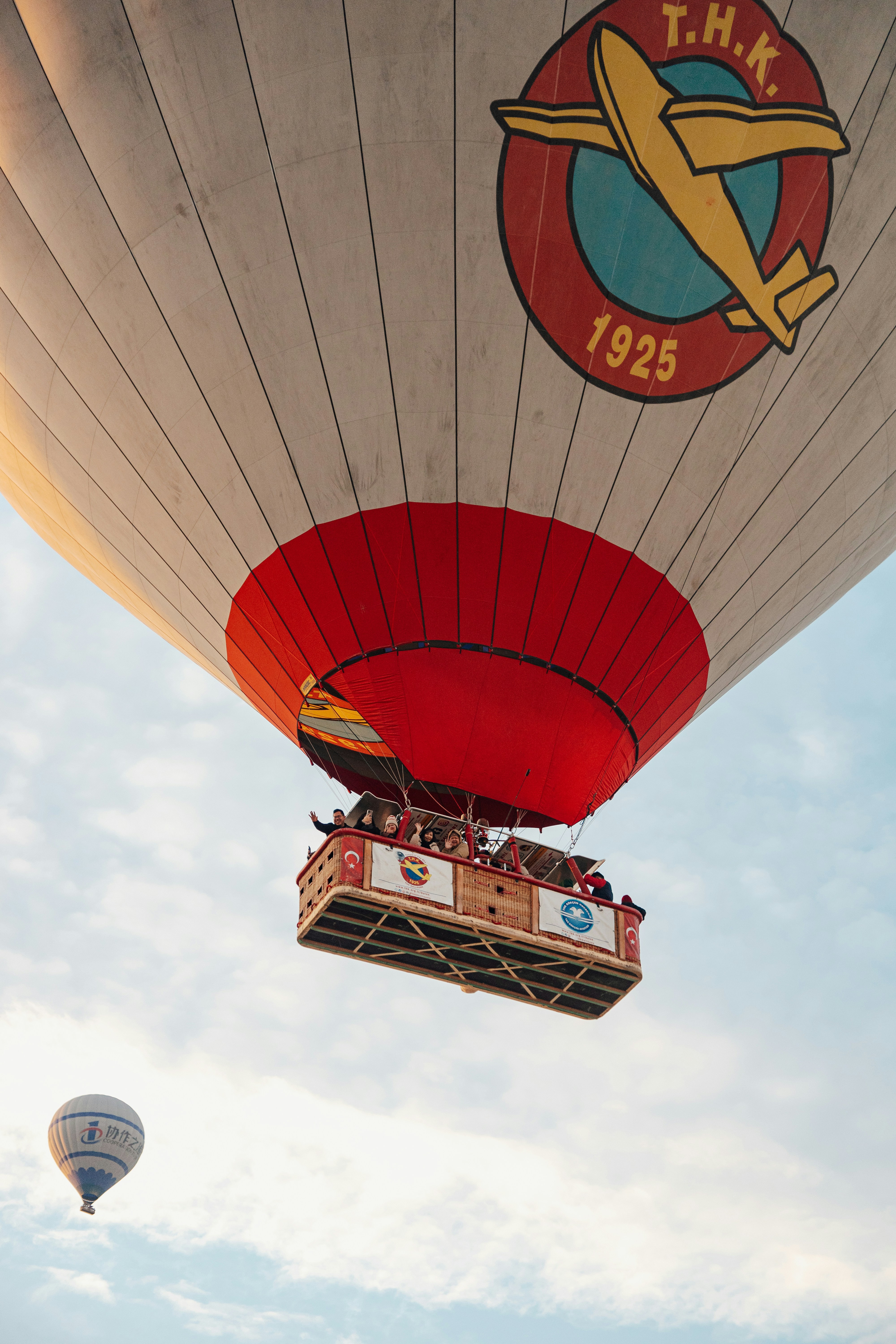 A large hot air balloon flying through a blue sky photo – Free Travel ...