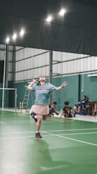 A man standing on a tennis court holding a racquet