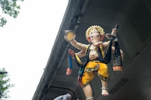 A statue of a person holding a bird
