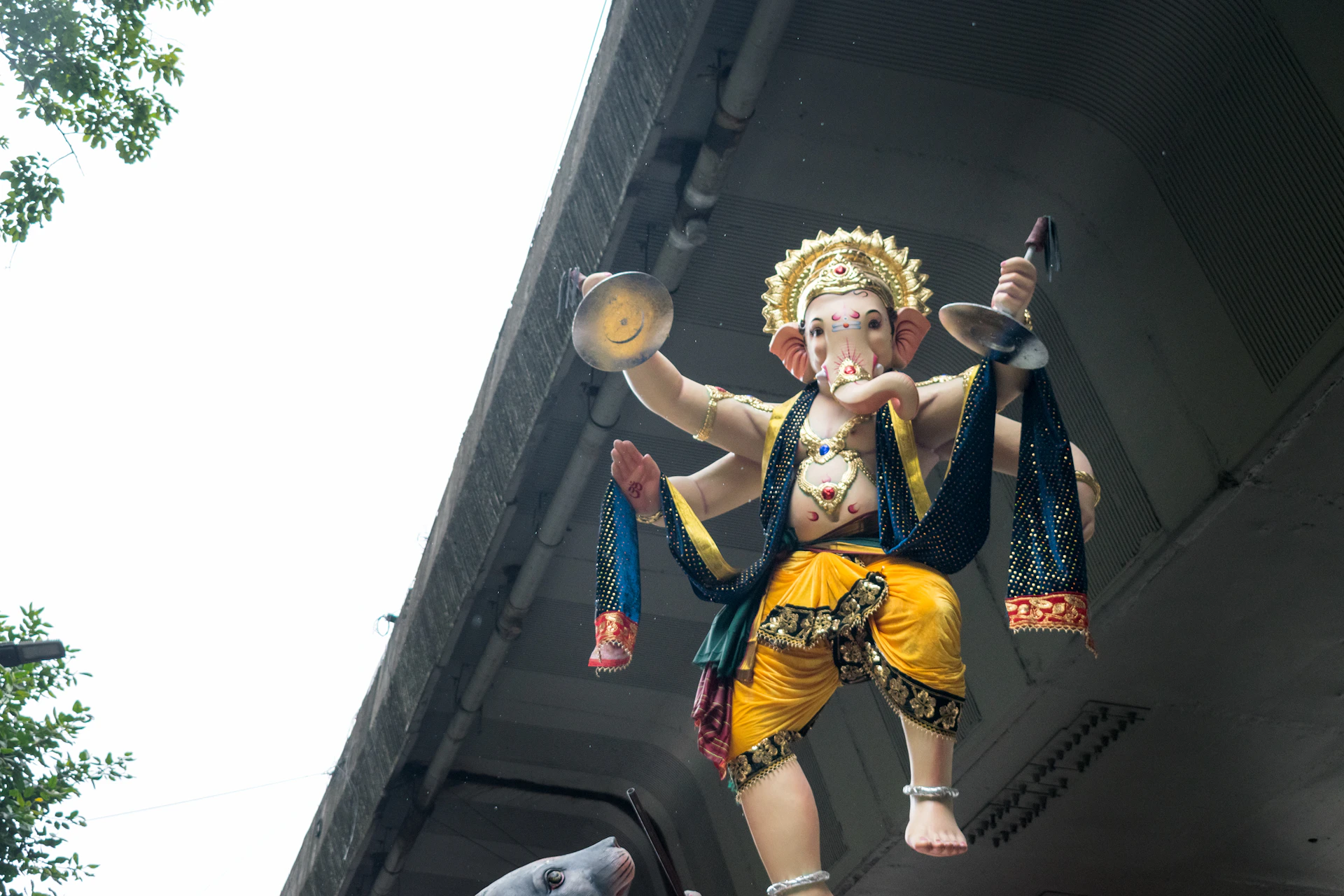 A statue of a person holding a bird