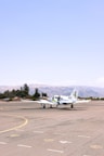 A small plane is sitting on the runway