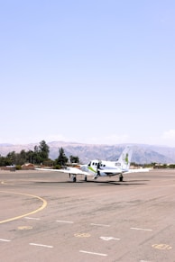 A small plane is sitting on the runway