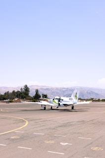 A small plane is sitting on the runway