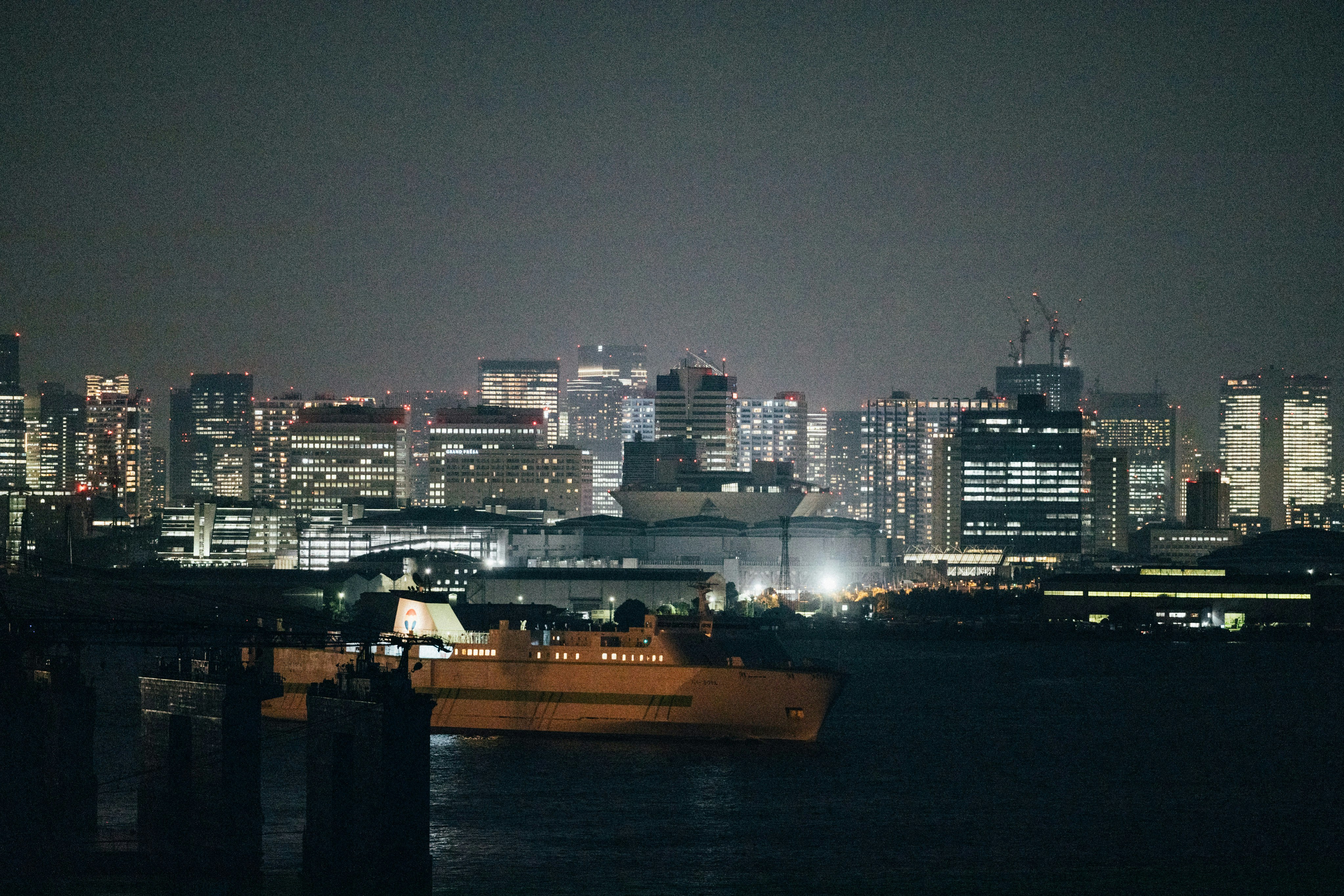 A large boat floating on top of a body of water