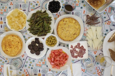 A table topped with lots of different types of food