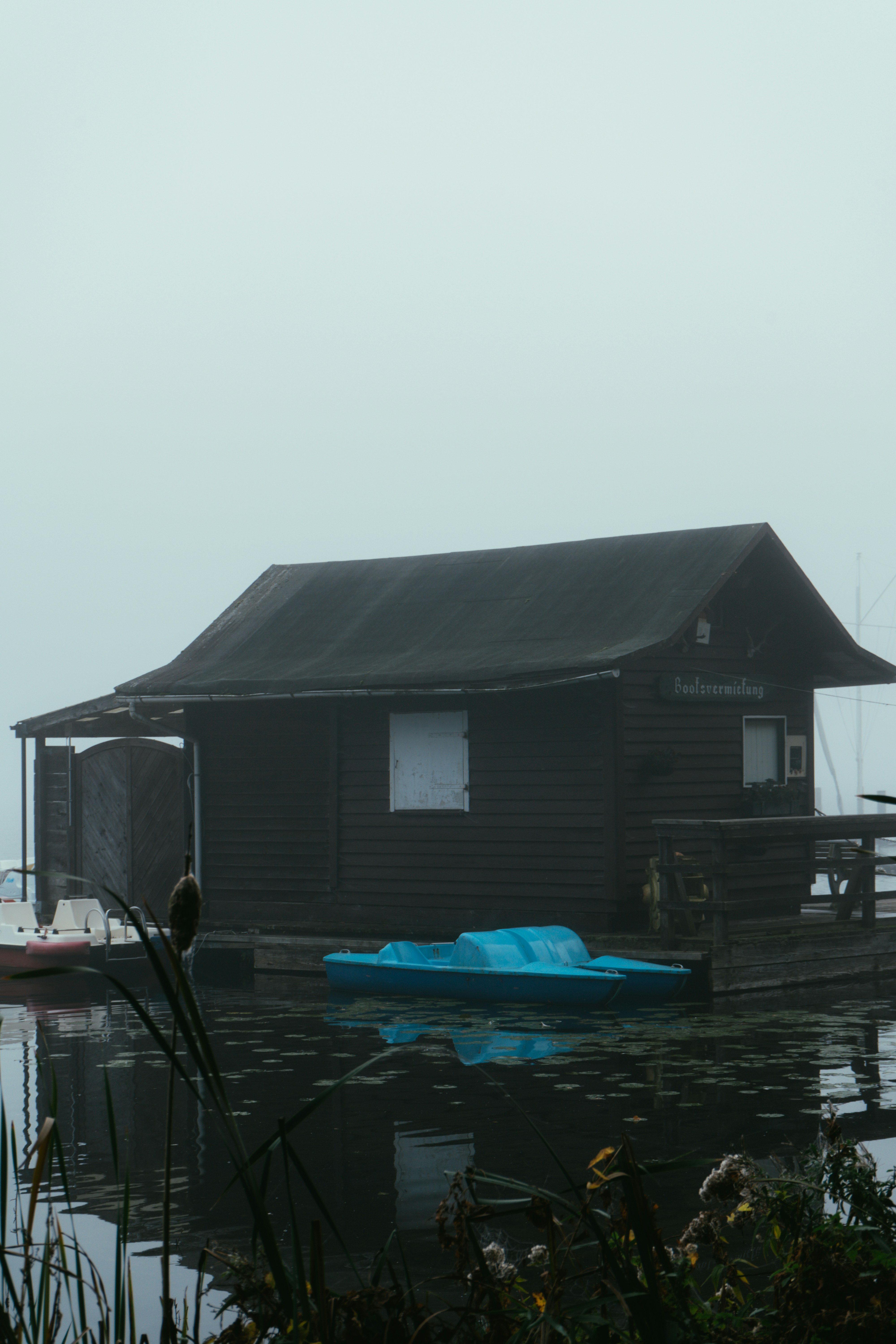 A house sitting on top of a body of water