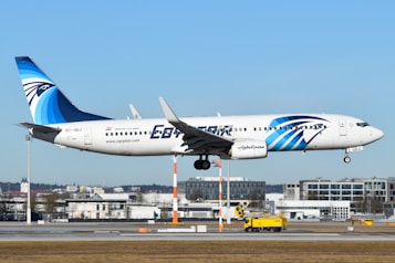 A large jetliner flying through a blue sky