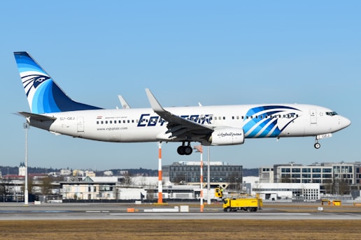 A large jetliner flying through a blue sky