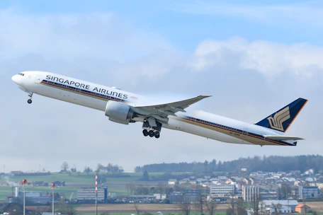 A large jetliner flying through a blue sky