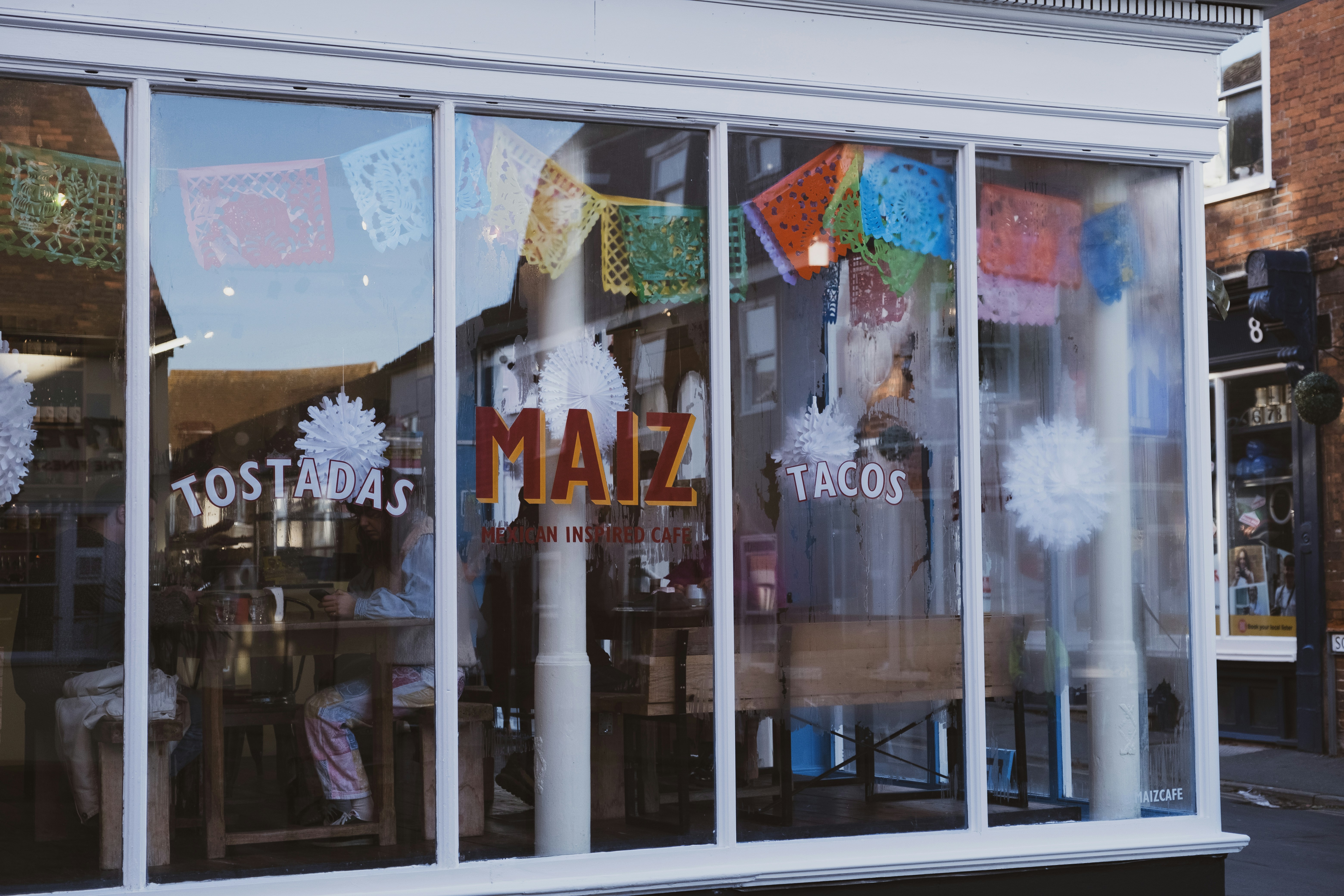 A store front with frosting on the windows