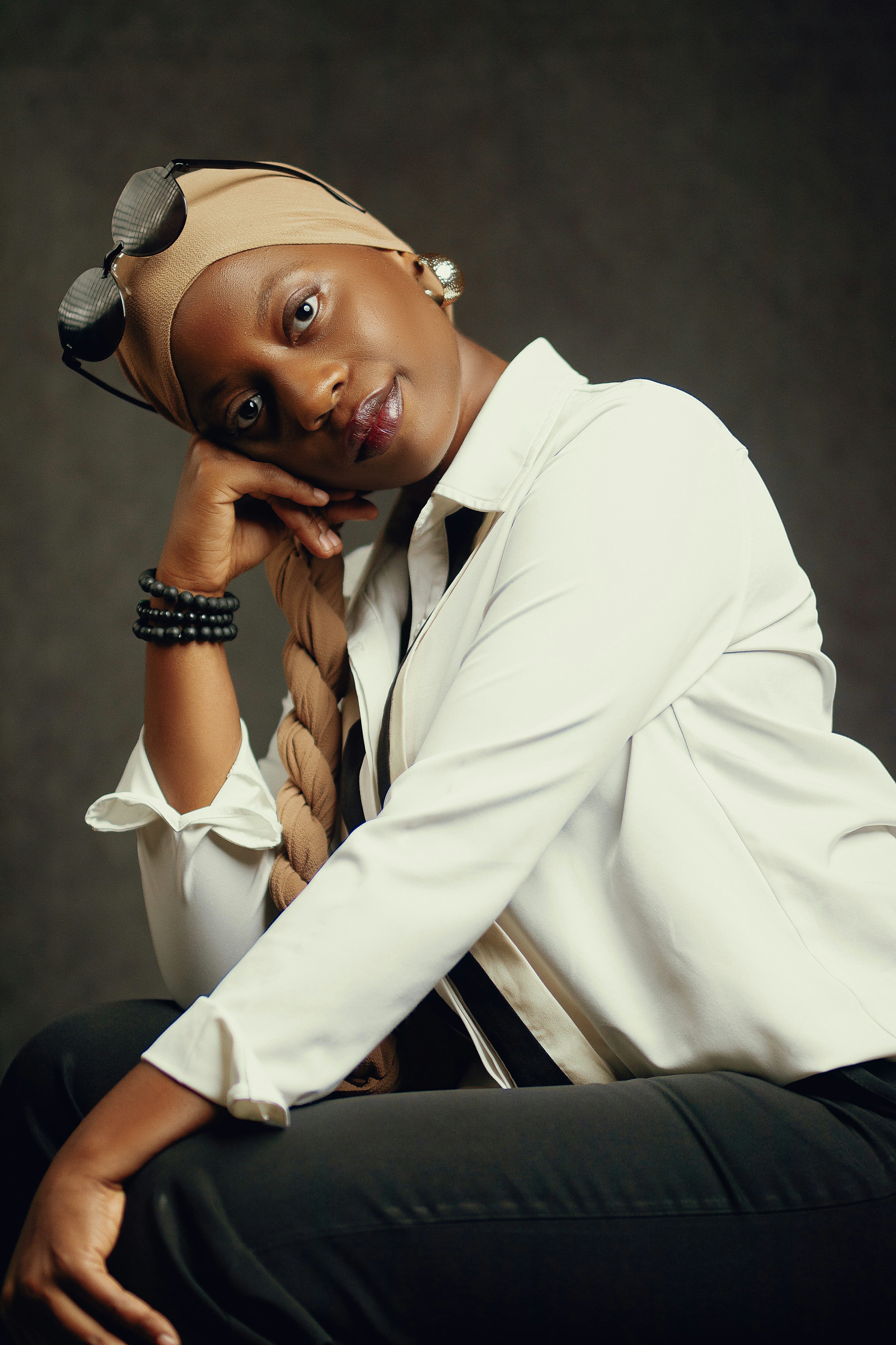 A woman in a white shirt and black pants