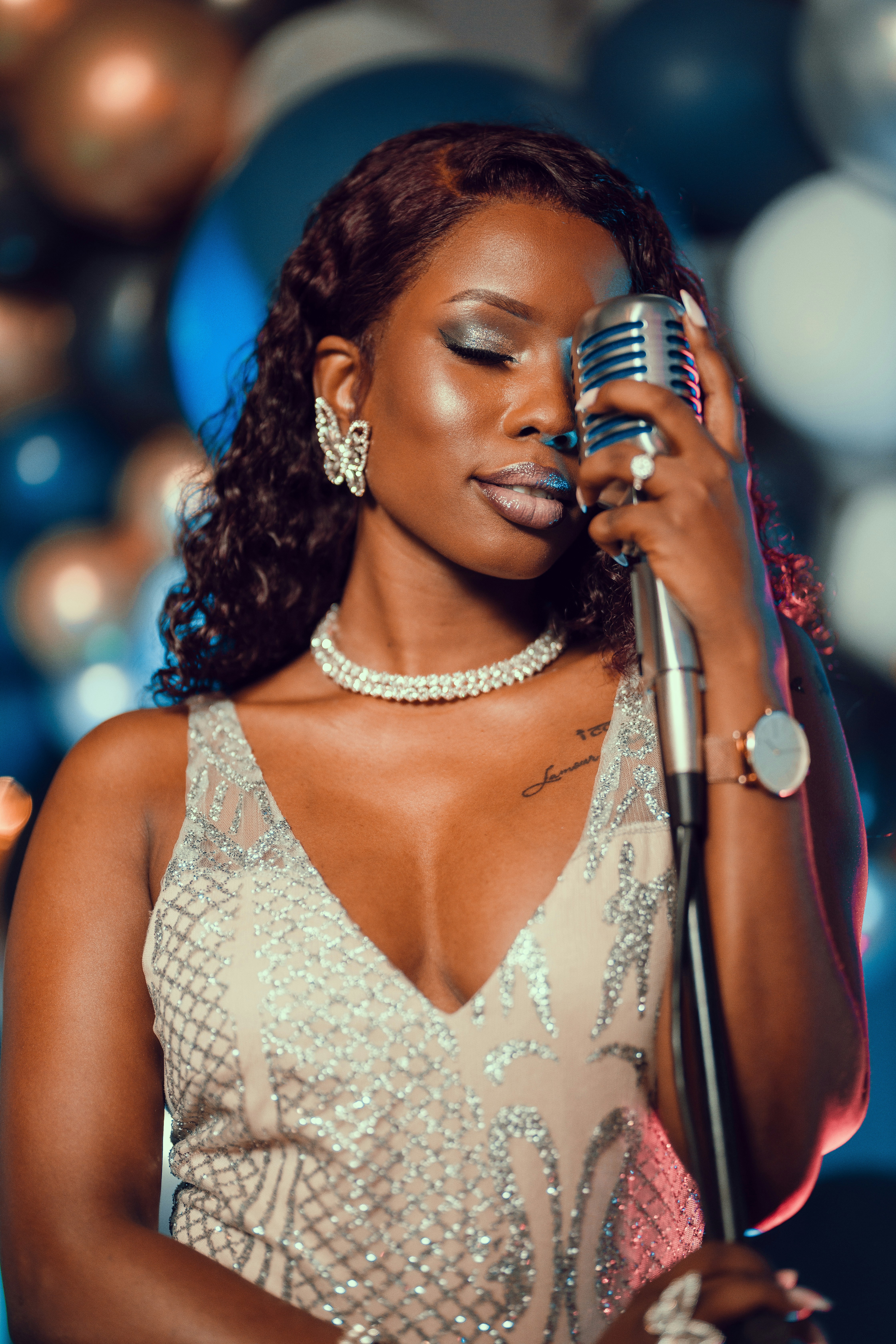 A woman in a dress holding a microphone