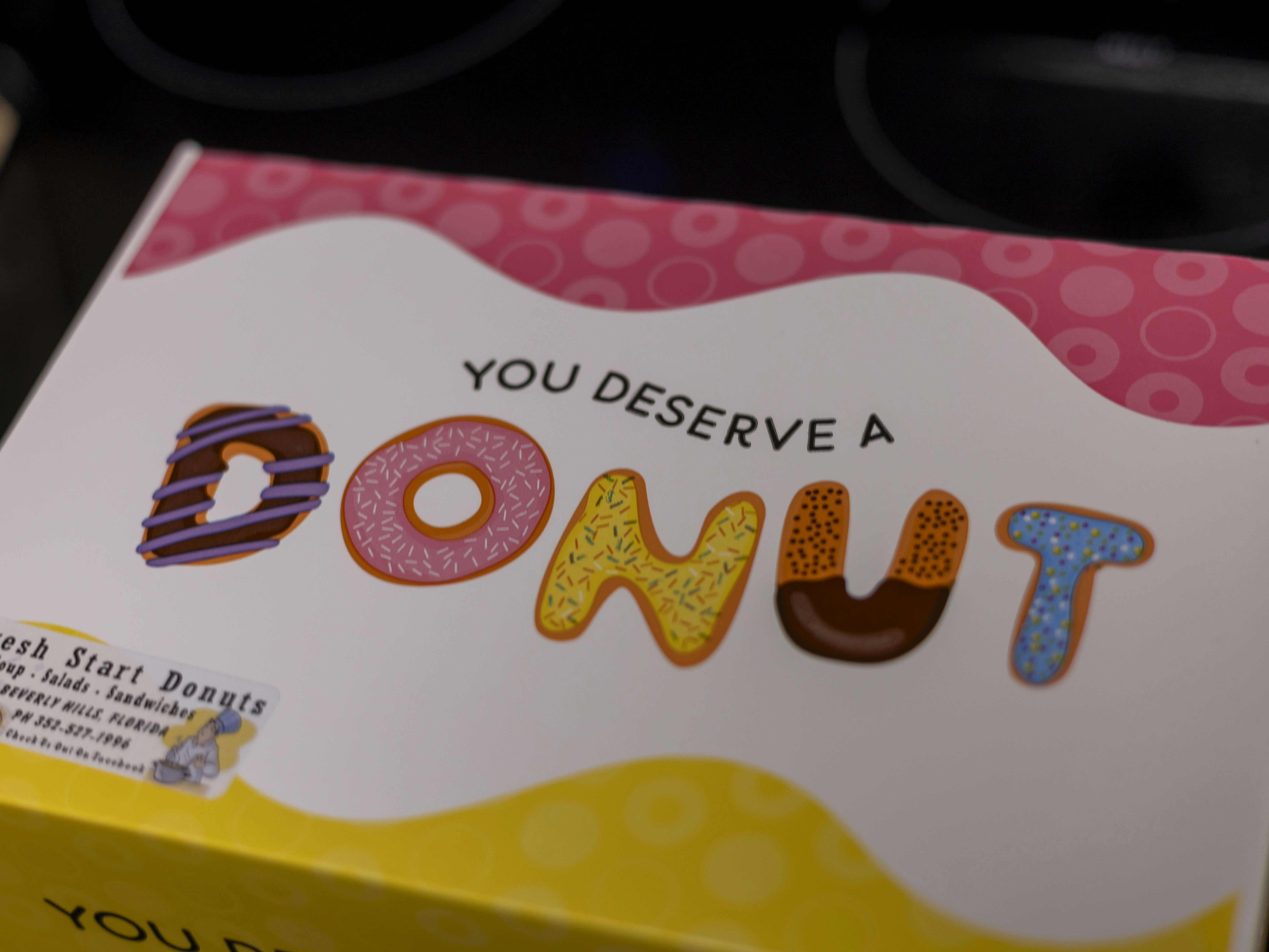 A box of donuts sitting on top of a table photo – Free Bakery Image on ...