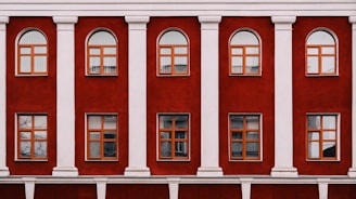 A red and white building with multiple windows
