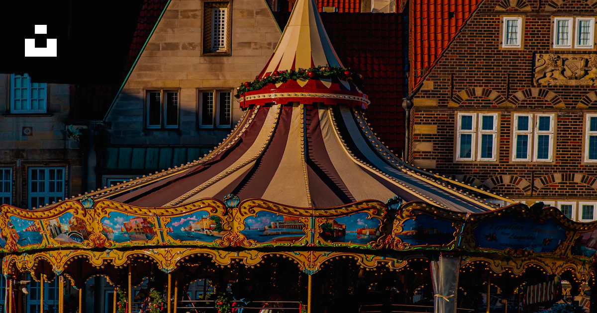 Merigo Rounf Front A merry go round in front of some buildings photo – Free Bremen Image ...