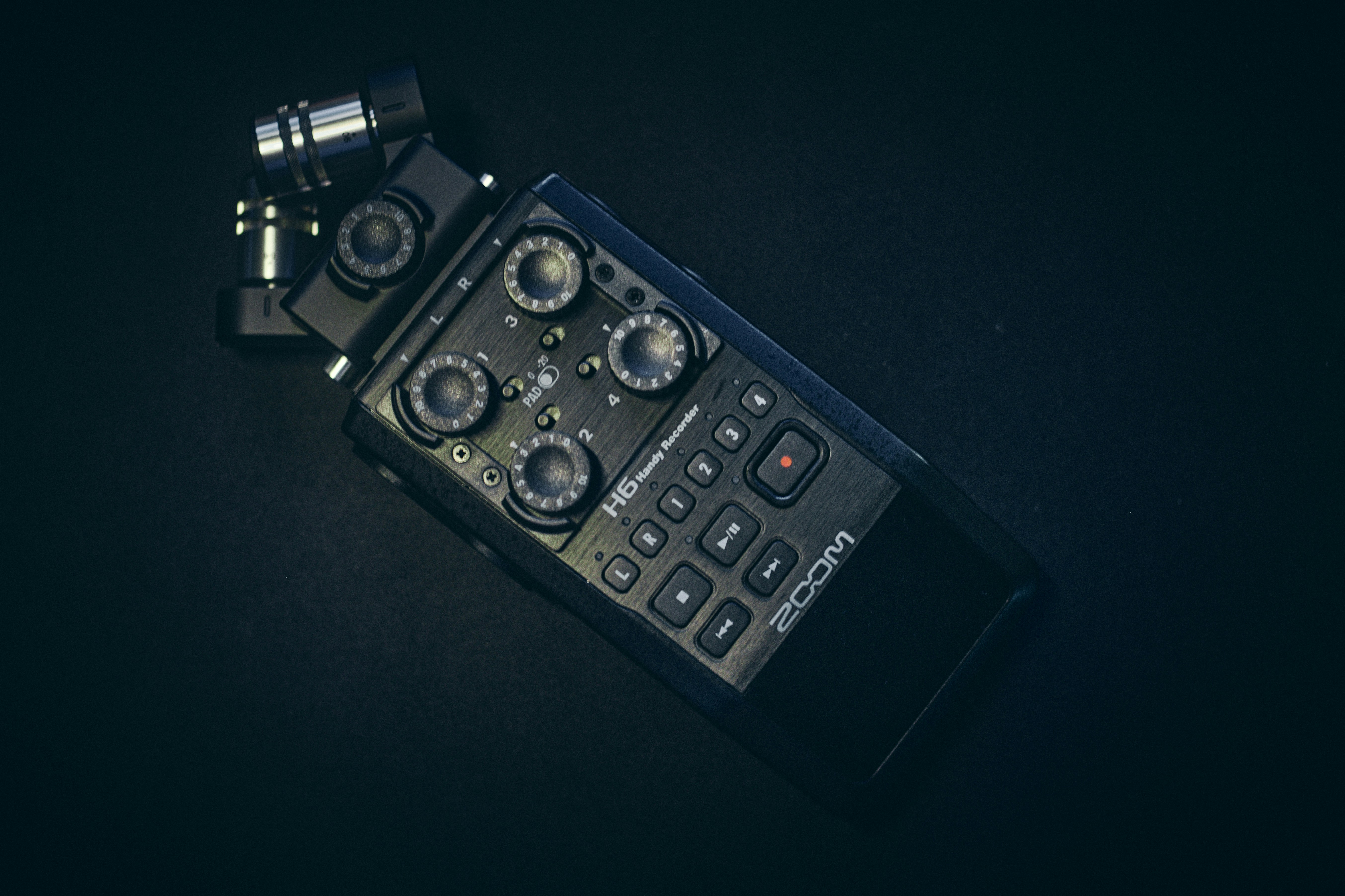 A close up of a cell phone on a black surface