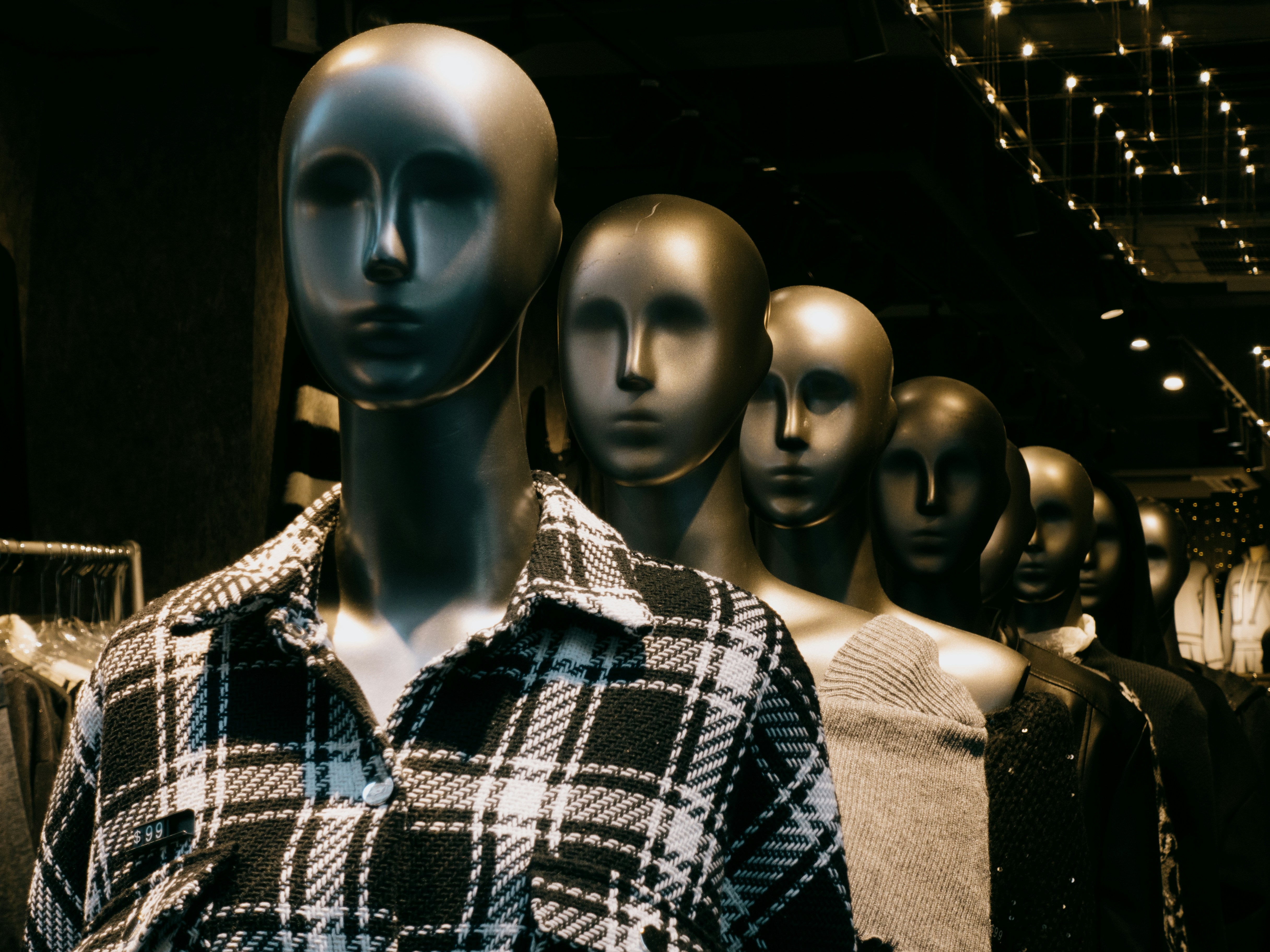 Branimo store window display featuring lined-up mannequins