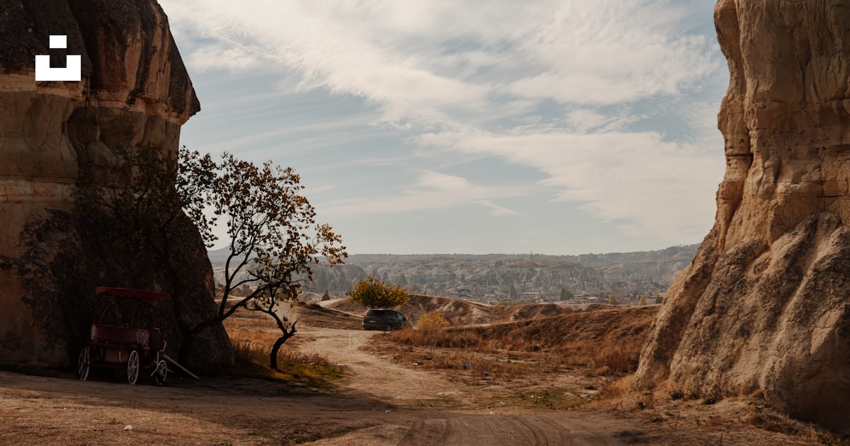 A dirt road between two large rocks photo – Free Göreme Image on Unsplash