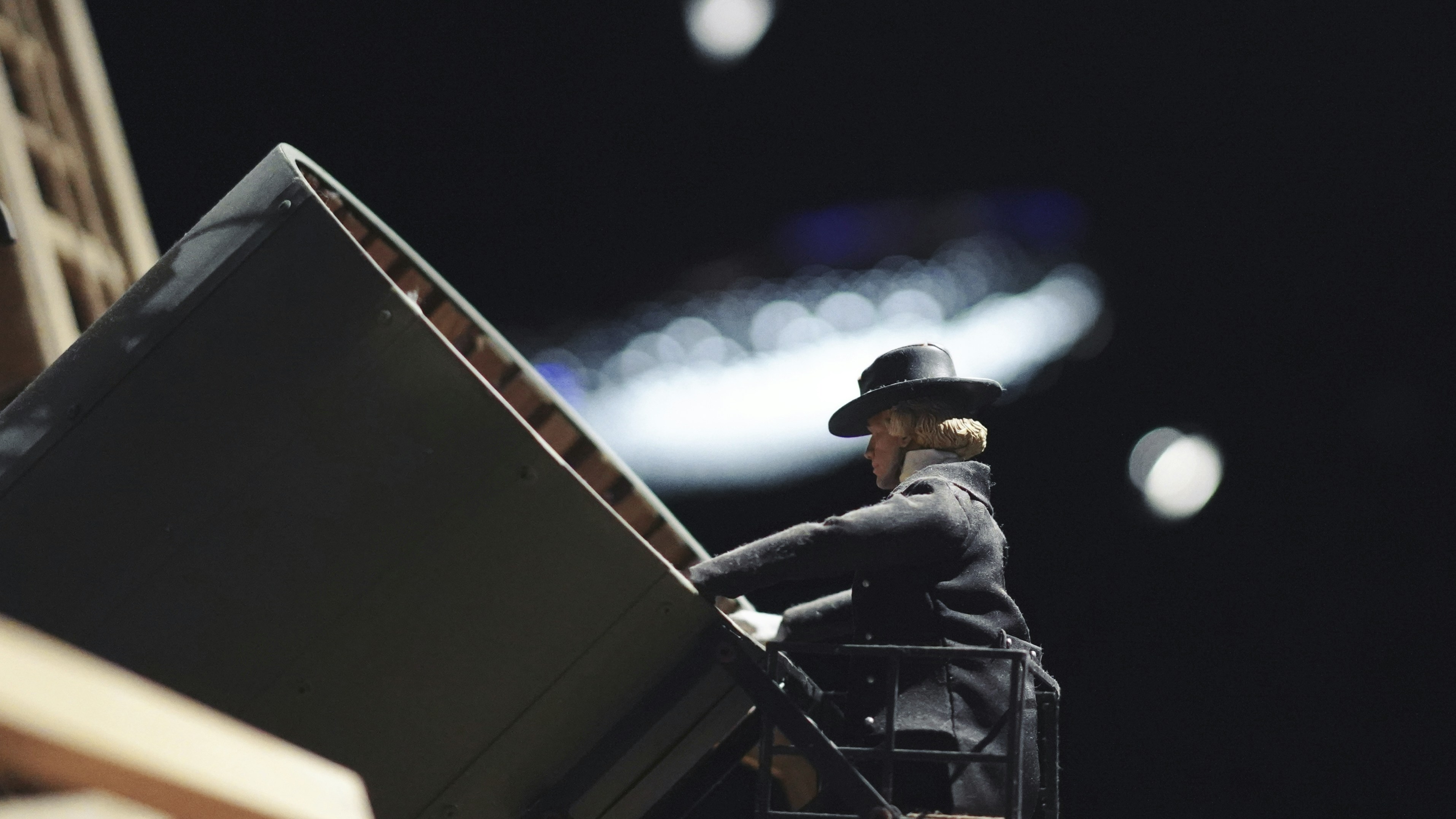 A figurine of a man with a suitcase