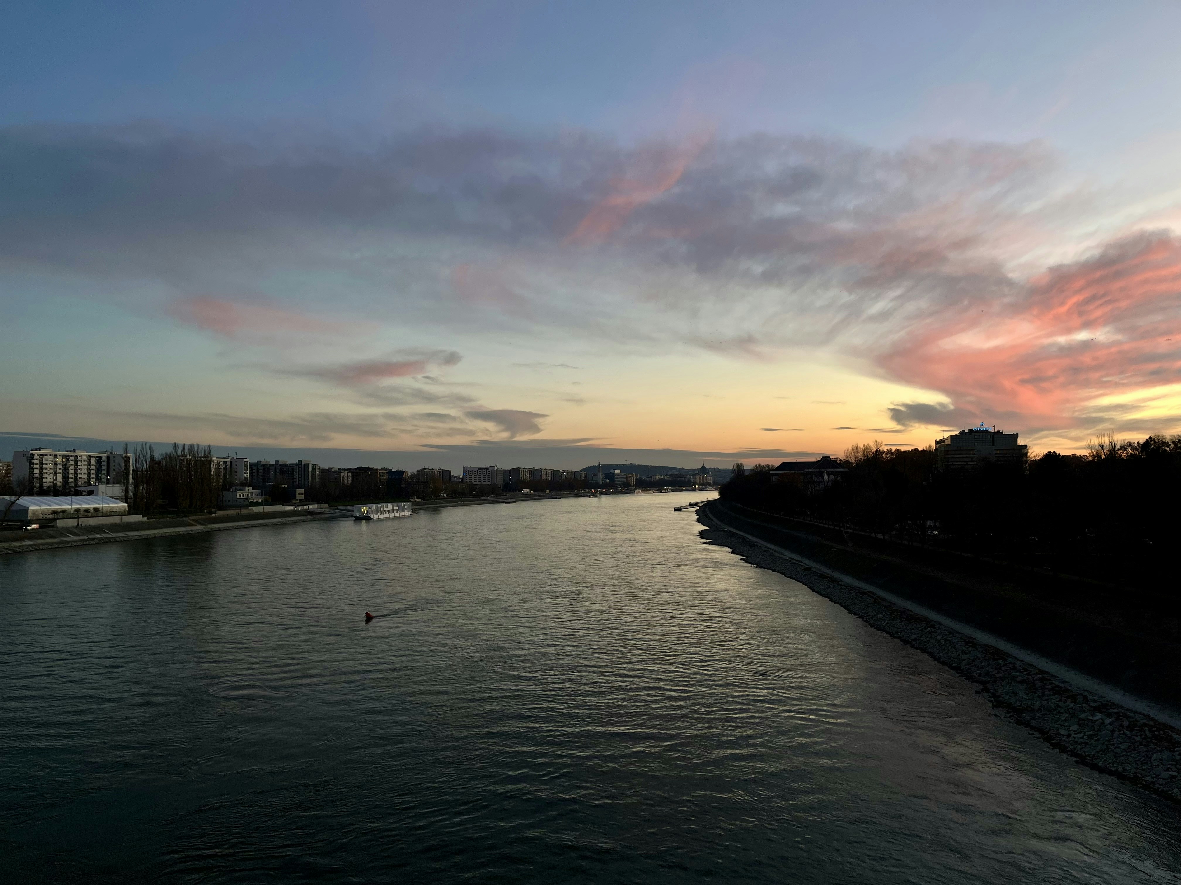 A view of a body of water at sunset