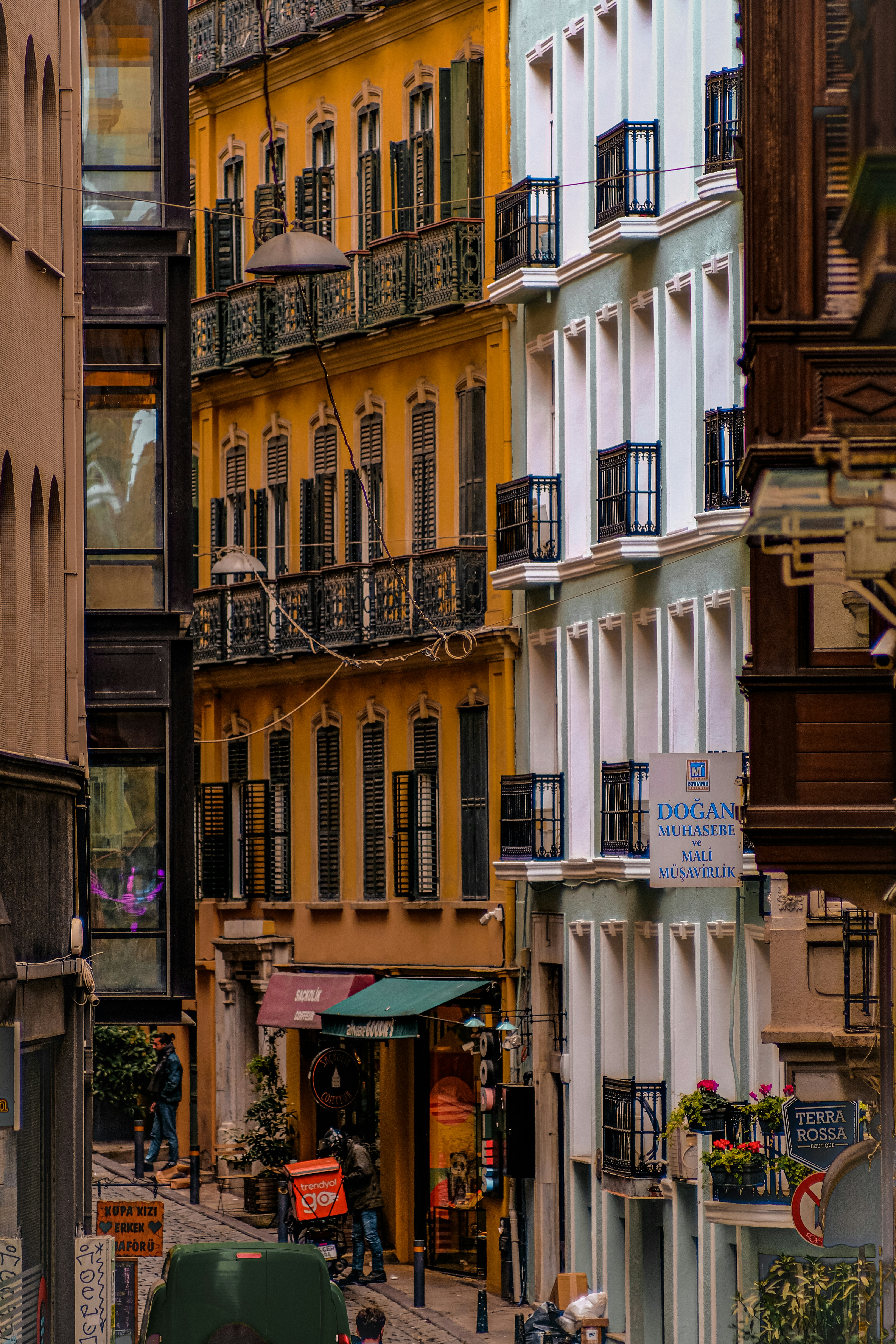 A city street filled with lots of tall buildings