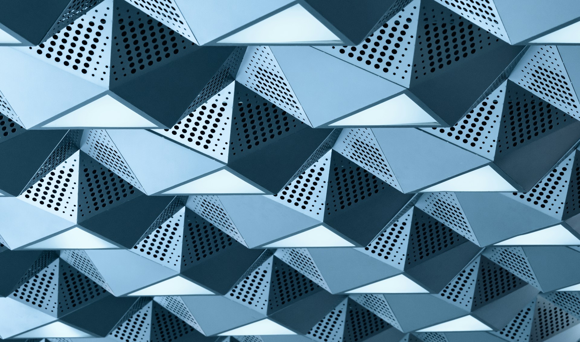 A metallic wall with a lot of triangles on it