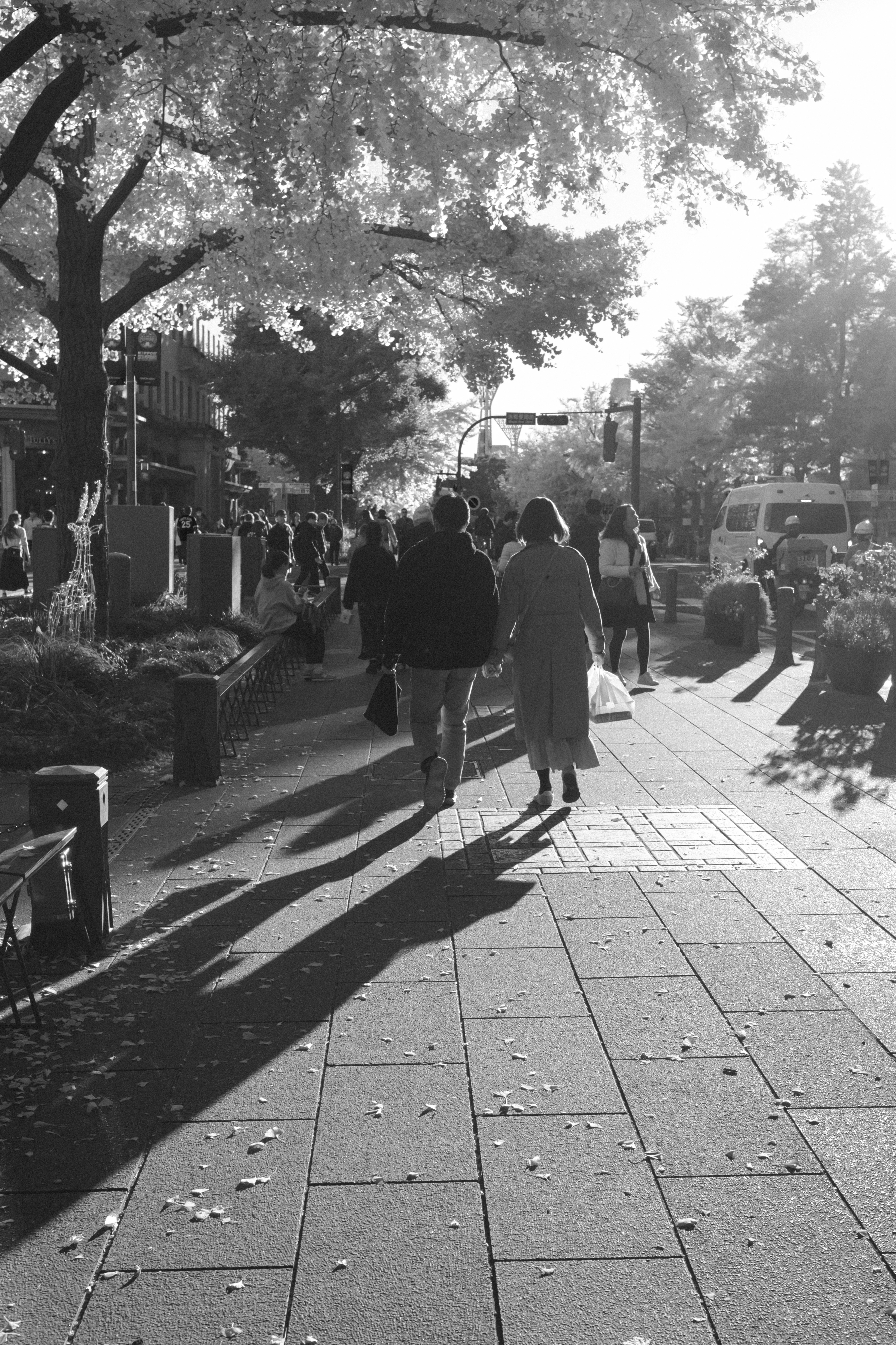 A black and white photo of people walking down a sidewalk photo – Free ...