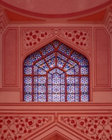 A window in a building with a blue sky in the background