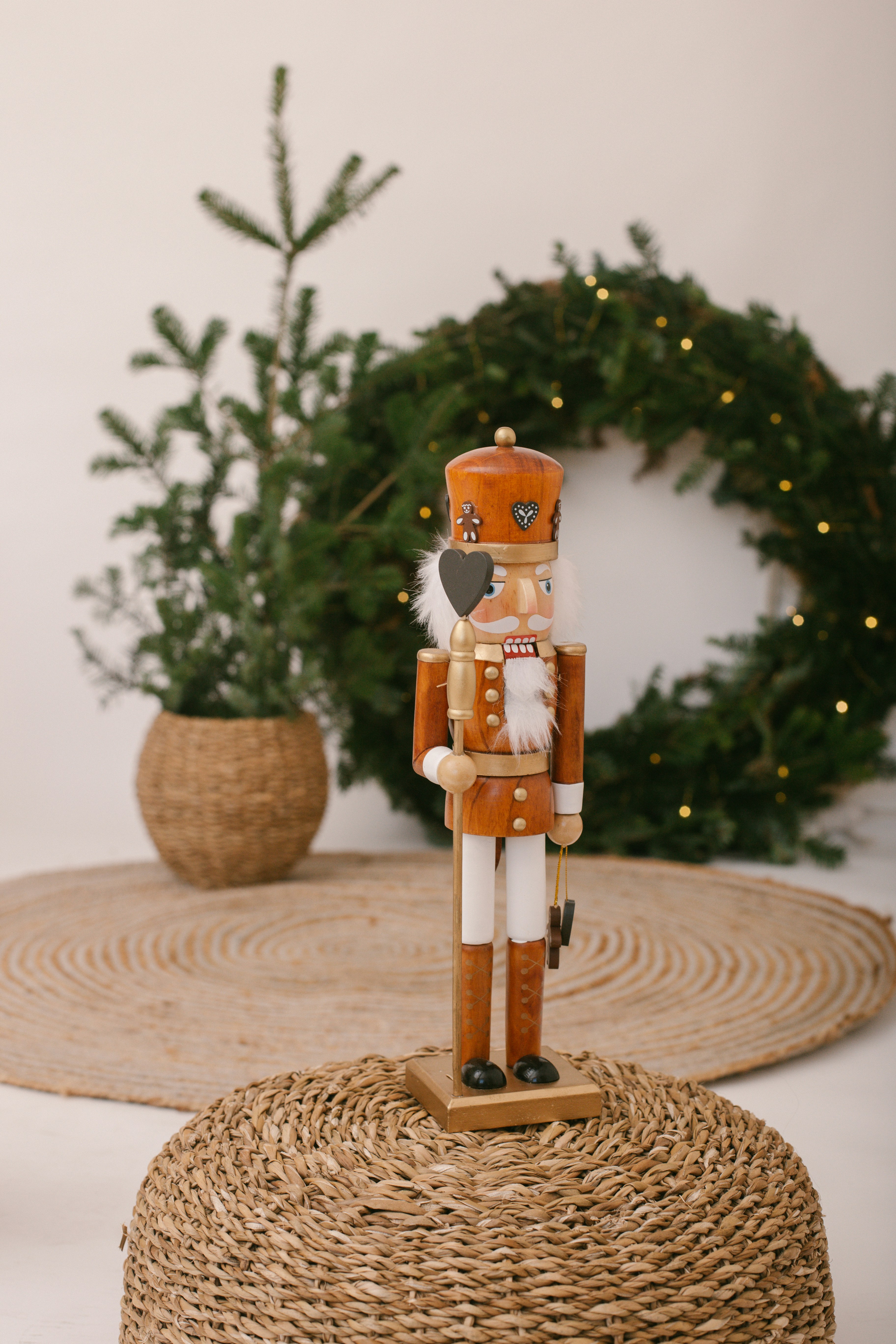 A nutcracker figurine sitting on top of a round table