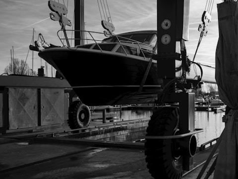 A black and white photo of a boat in the water