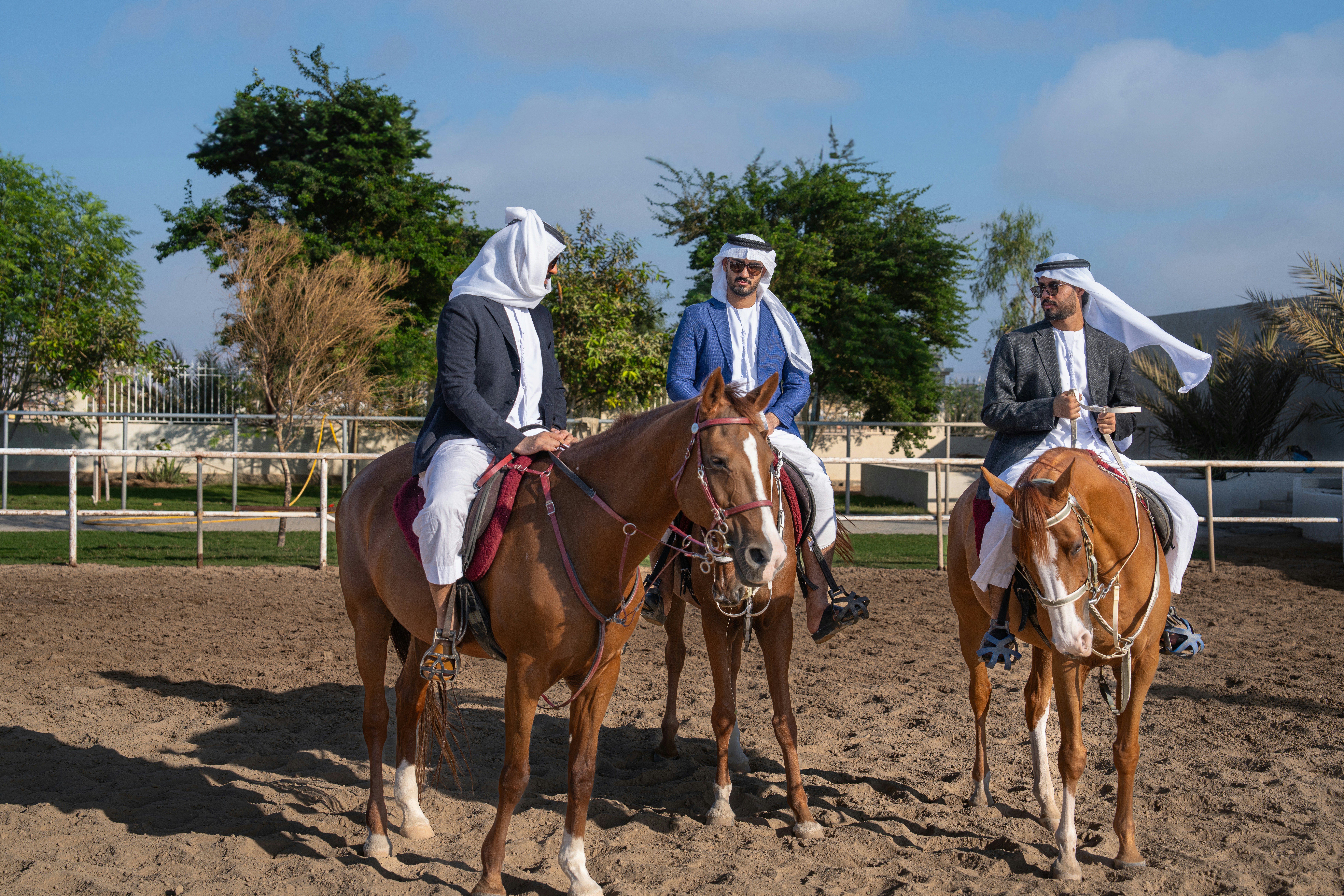 A group of people riding on the backs of horses