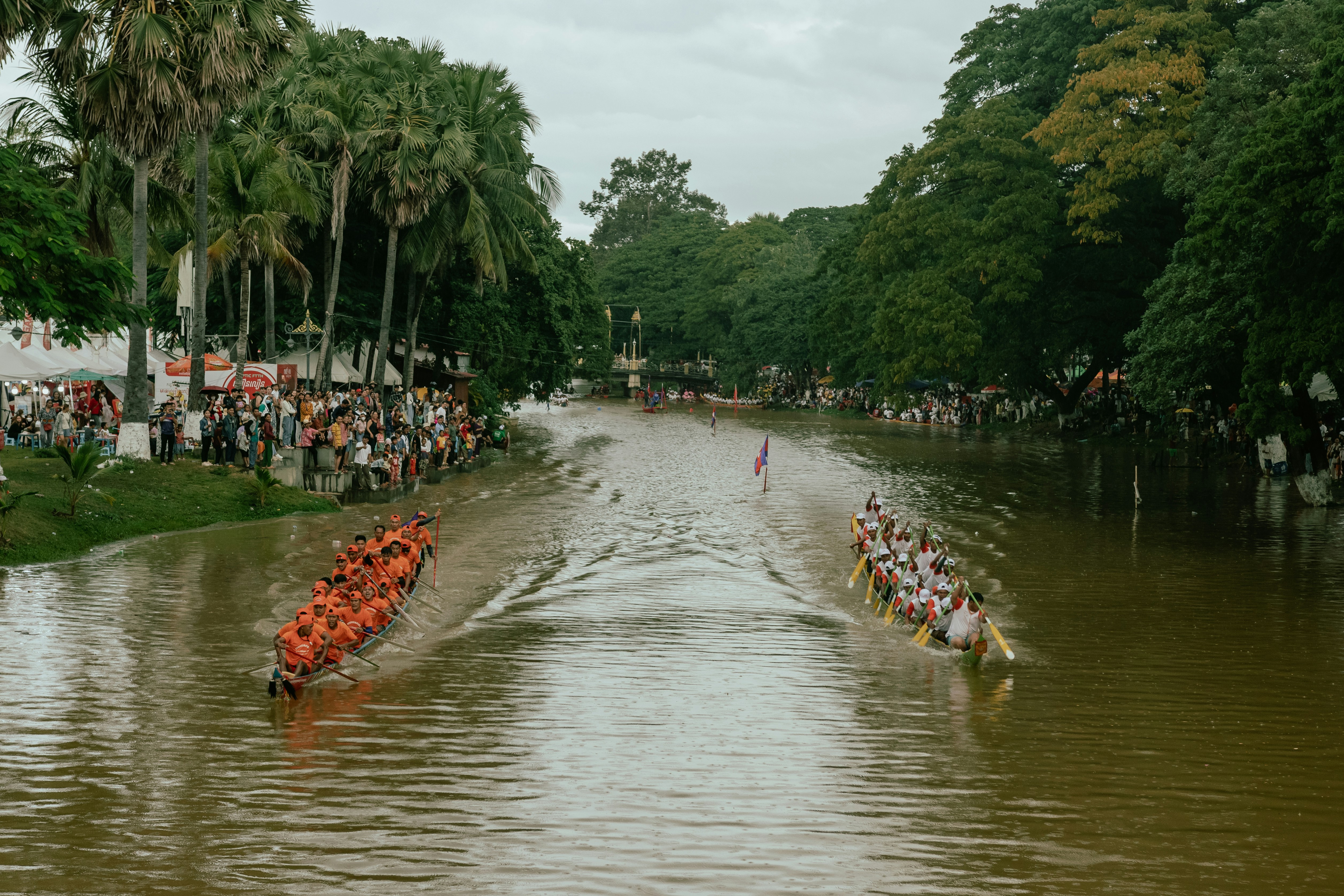 A group of people riding in a boat down a river