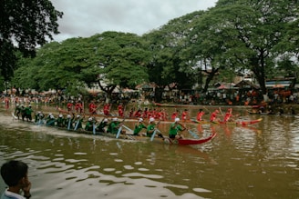 A group of people riding on top of a long boat