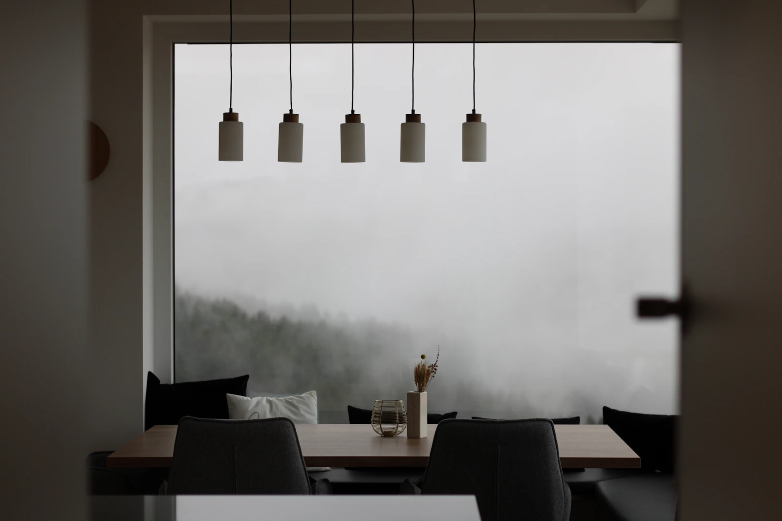 Dining room with a solid stone table and wood accents