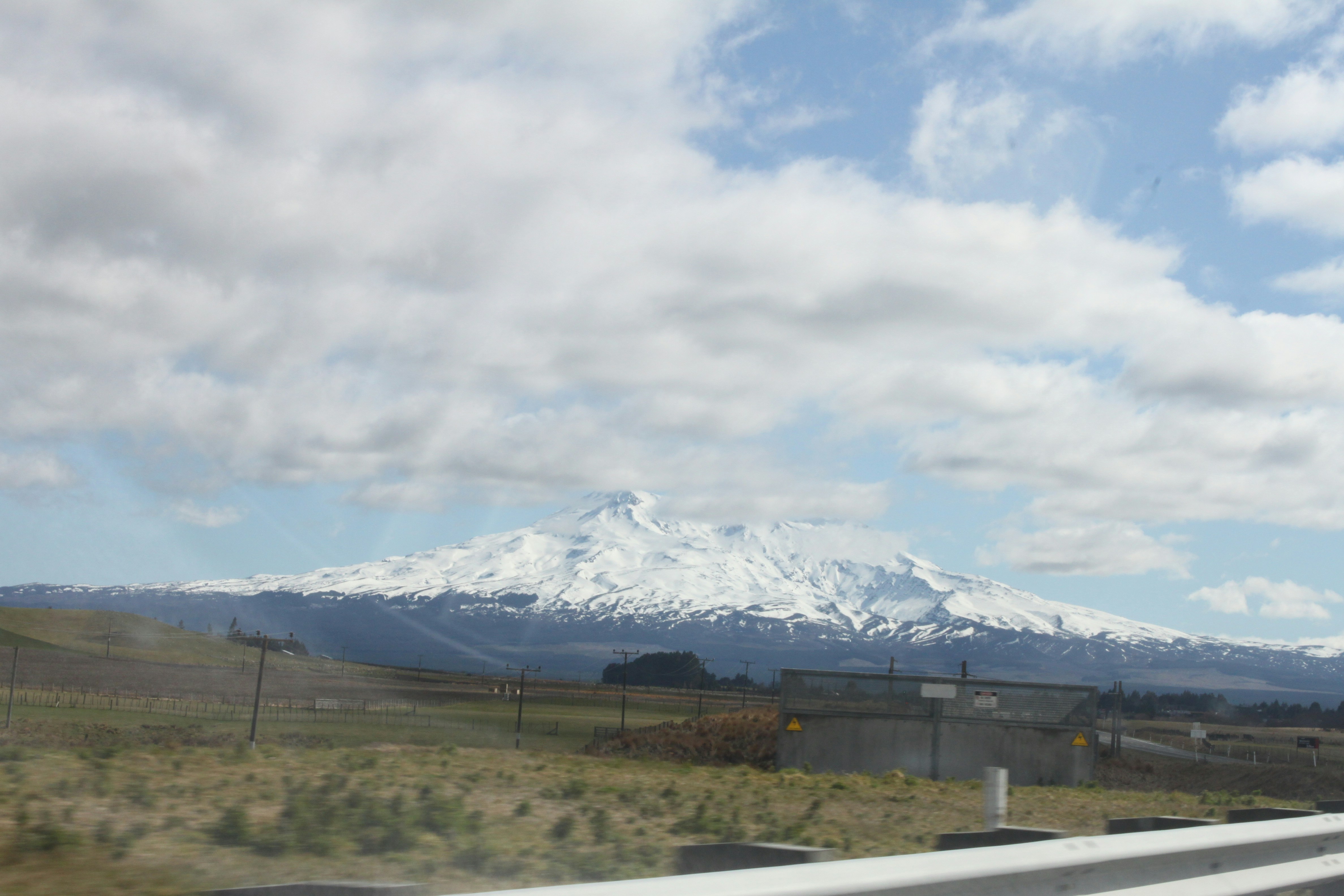 A highway with a mountain in the background