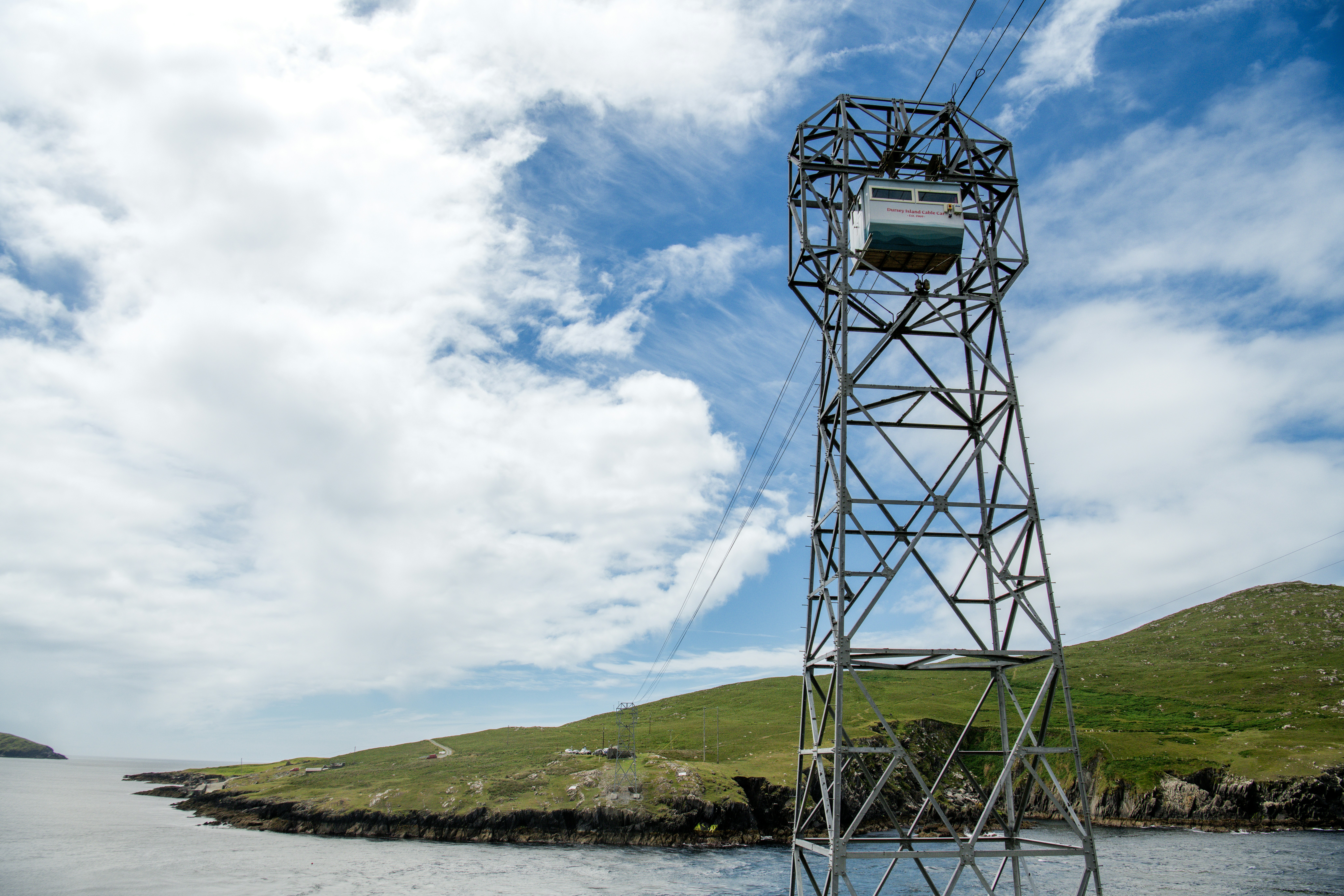 A tall tower sitting in the middle of a body of water