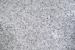 A black and white photo of a granite counter top