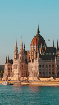 A large building sitting on top of a body of water