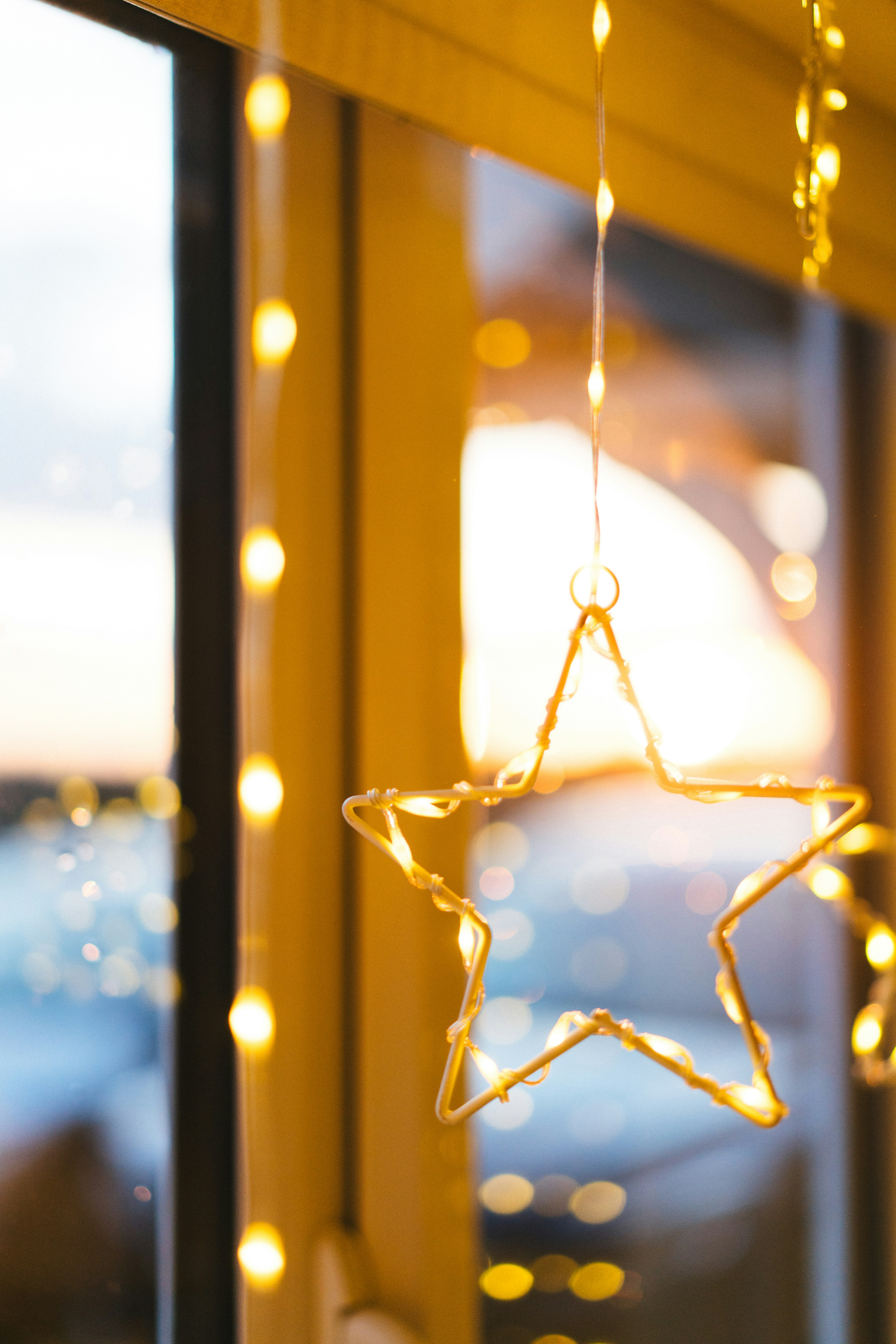 A window with a star hanging from it's side