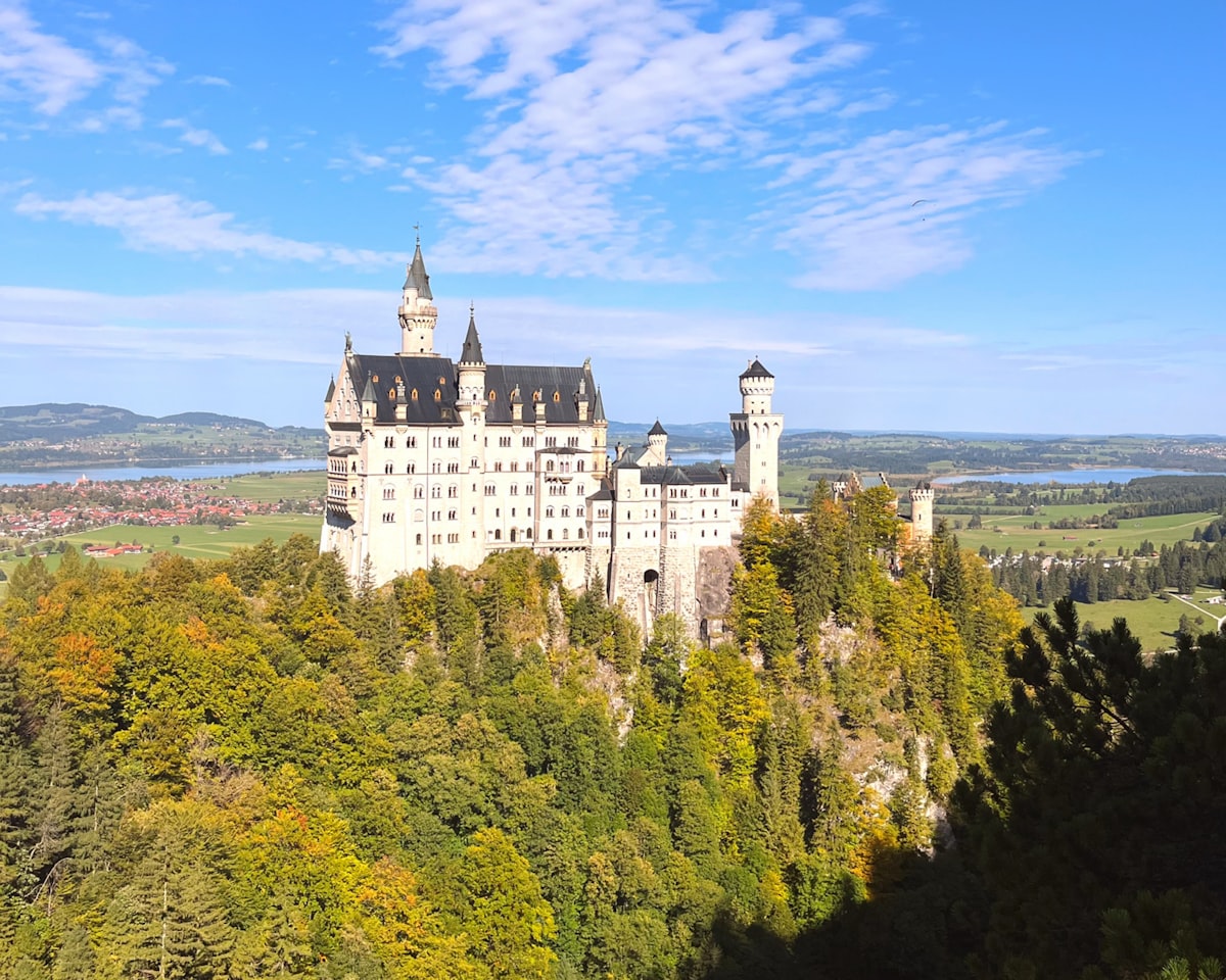 white and gray concrete castle under blue sky during daytime