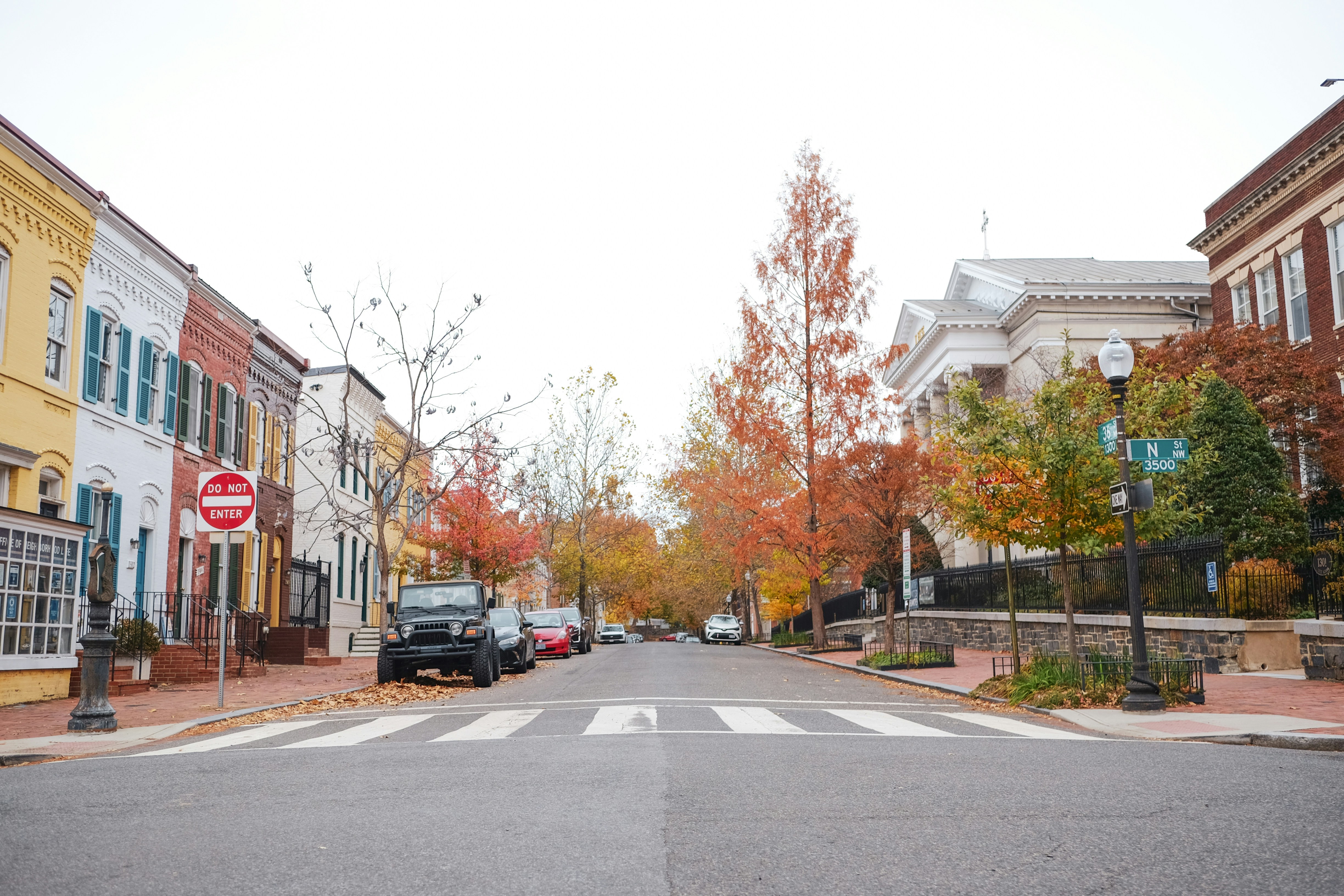 A city street with a stop sign on the corner