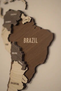 A wooden map of the world with countries