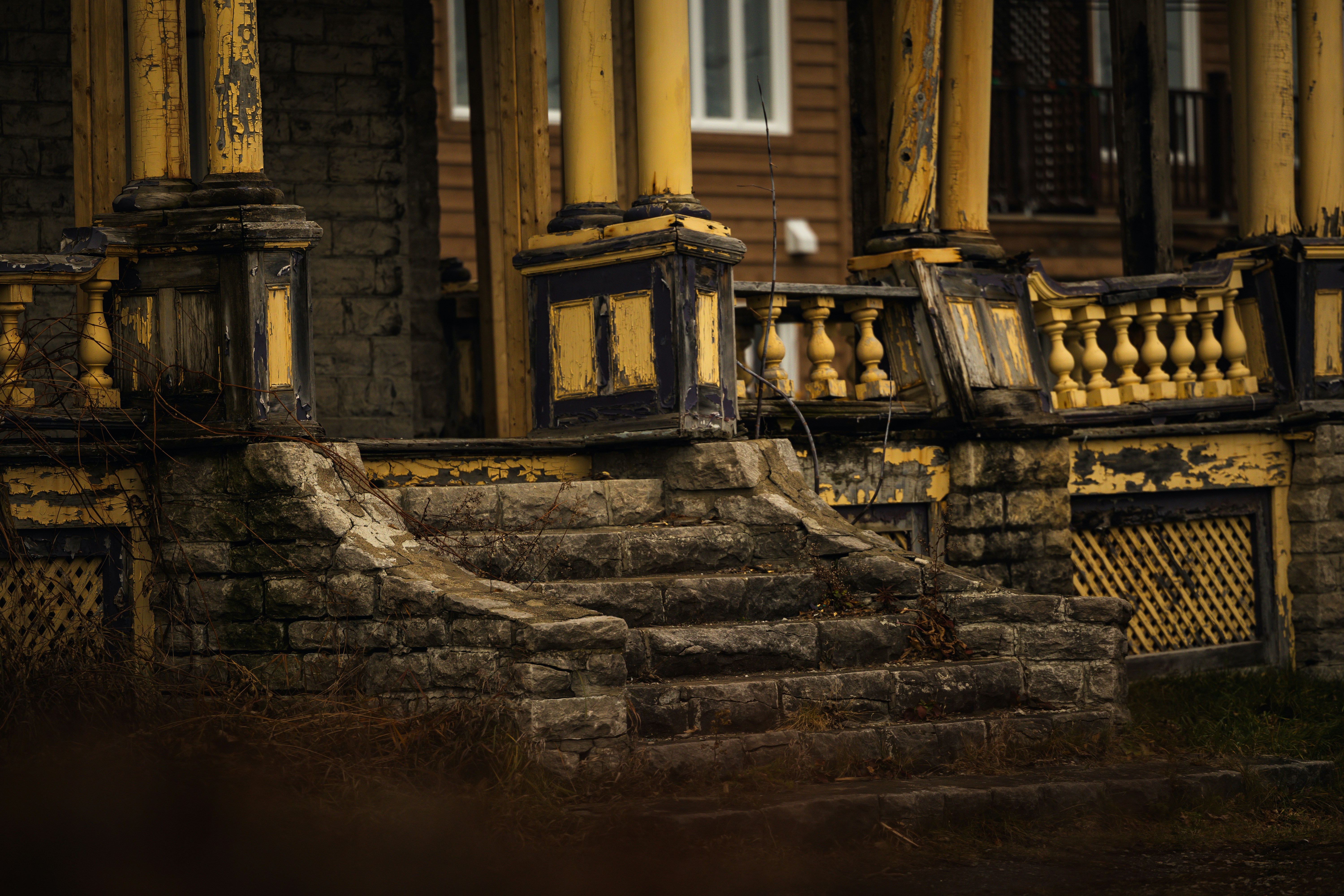 An old building with a bunch of yellow pillars